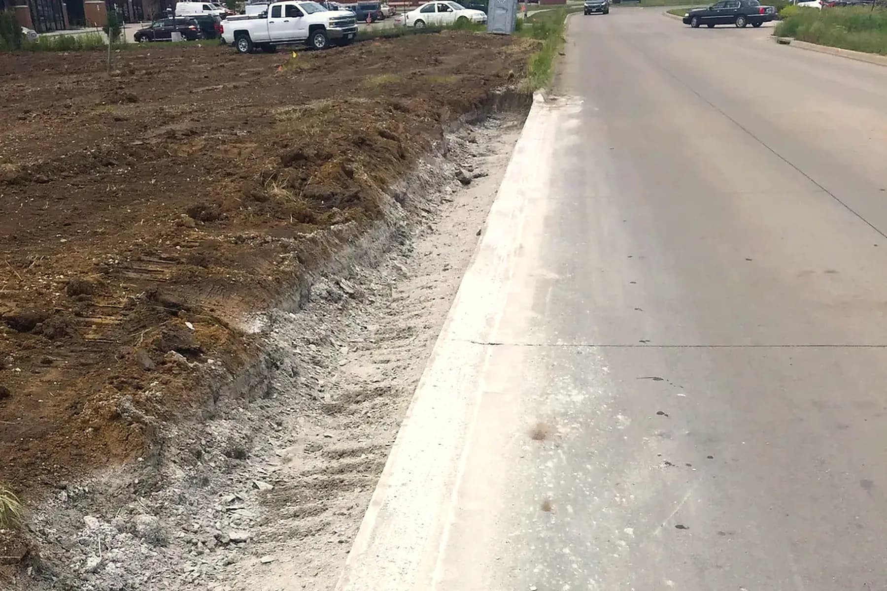 Commercial curb grinding on a new Iowa roadway development