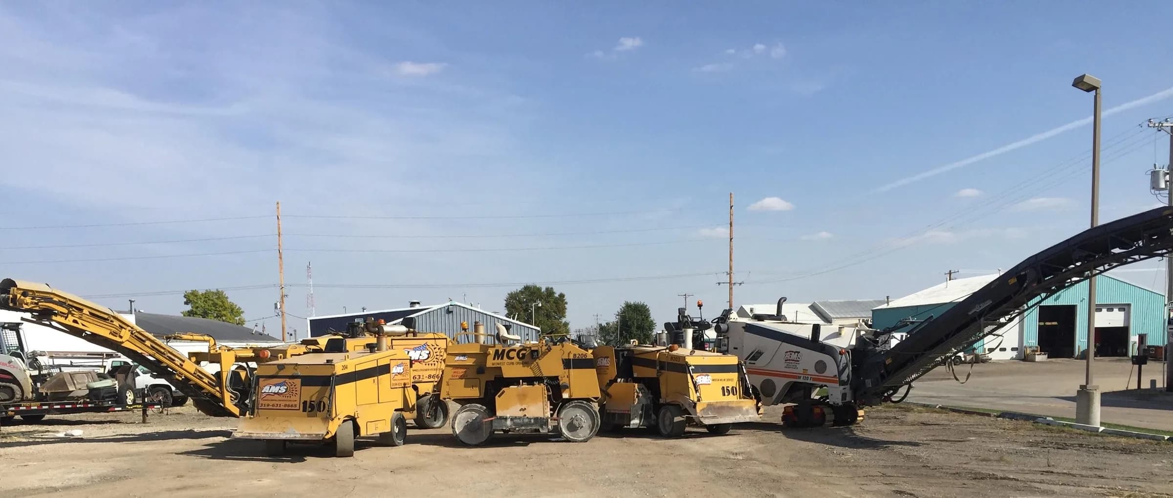 The Midwest Curb Grinding equipment fleet lined up at the Iowa shop