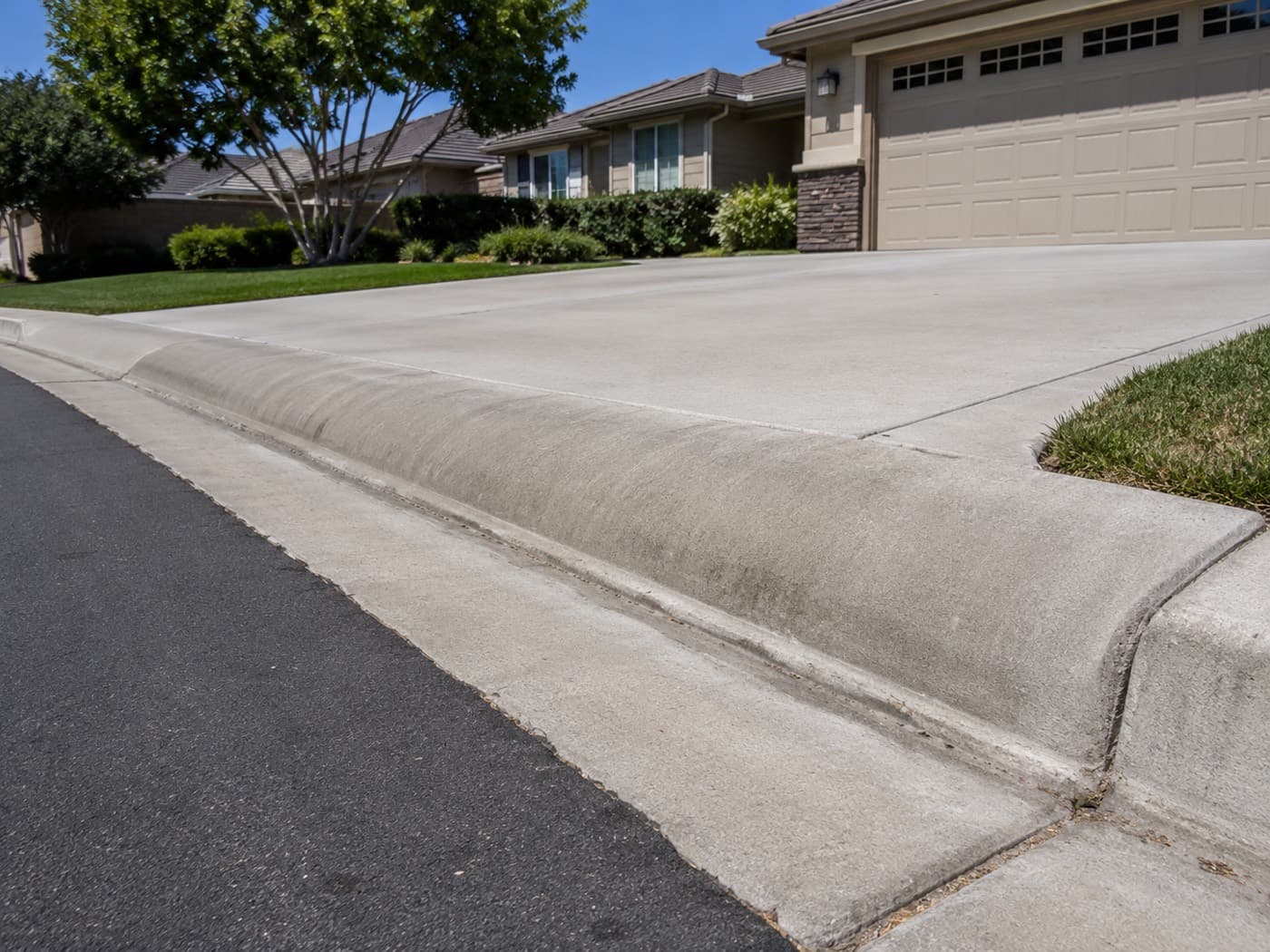 Roll curb at the end of a residential driveway