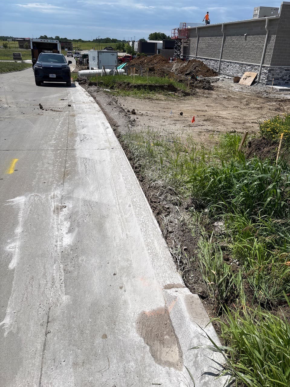 Long curb grind taken down to grade on 302nd Place in Adel, Iowa
