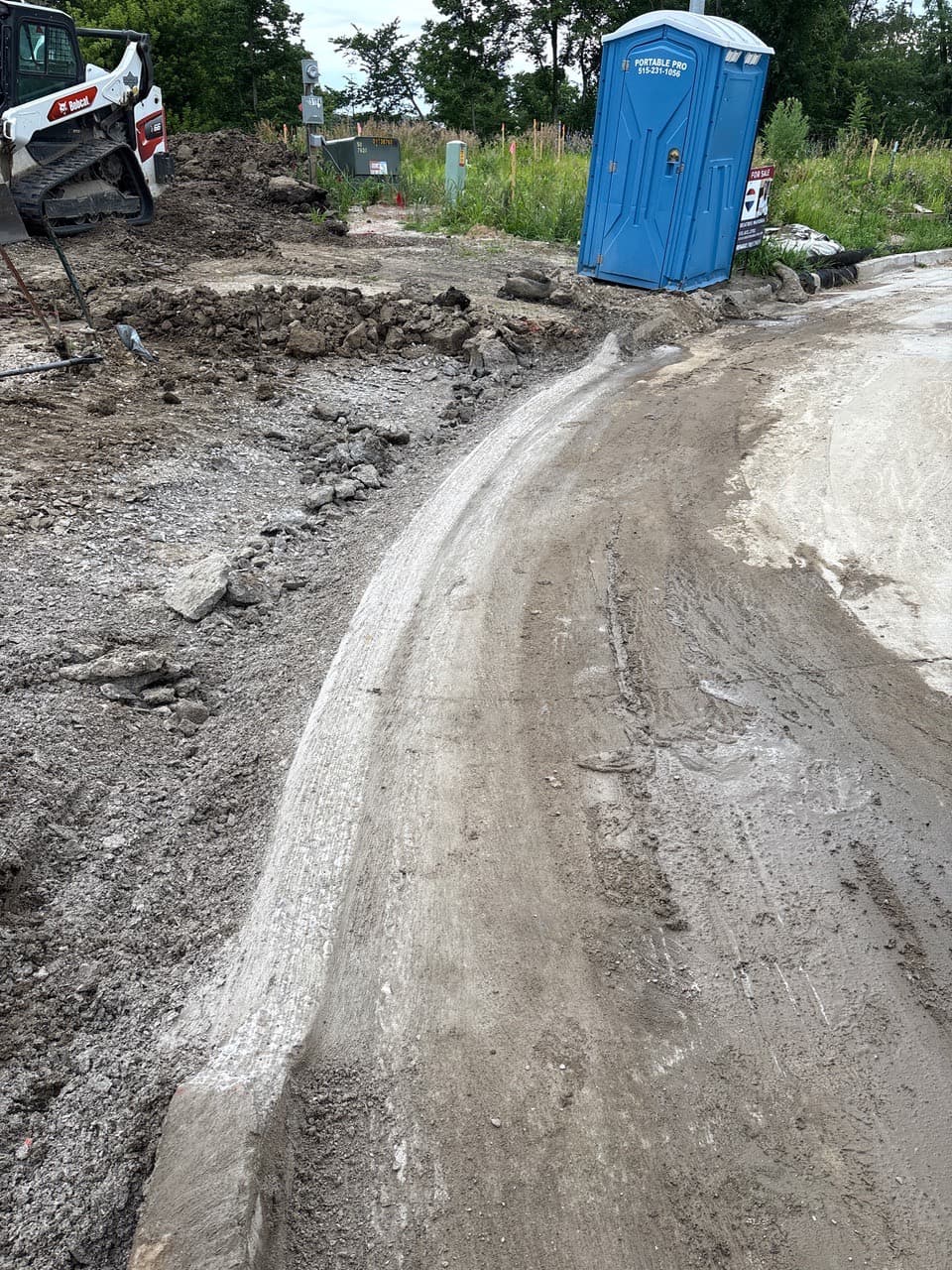 Curb grinding for a driveway approach on Woodbury Circle in Altoona, Iowa