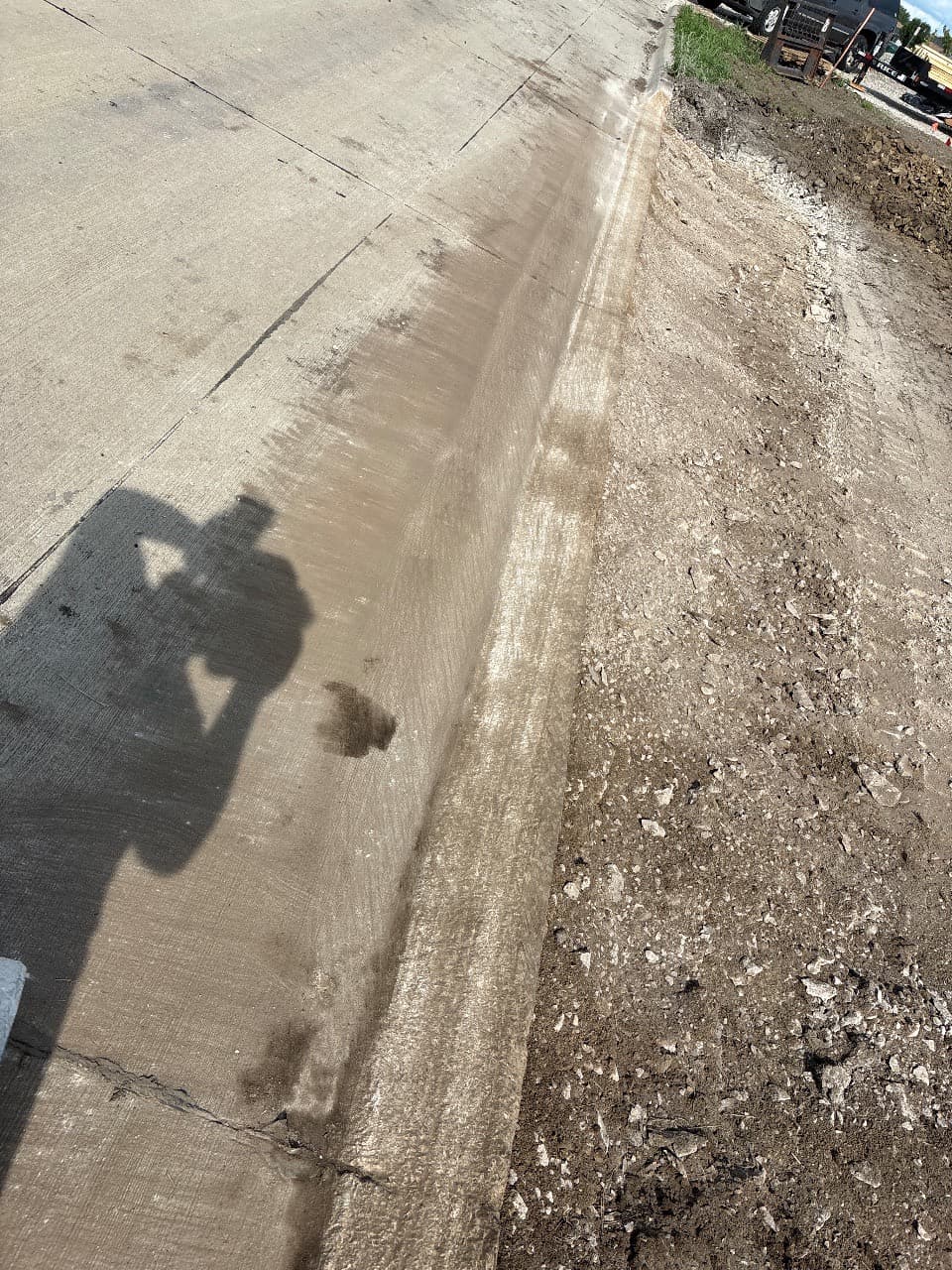 Curb grinding for a new driveway approach on Messina Drive NE in Cedar Rapids, Iowa