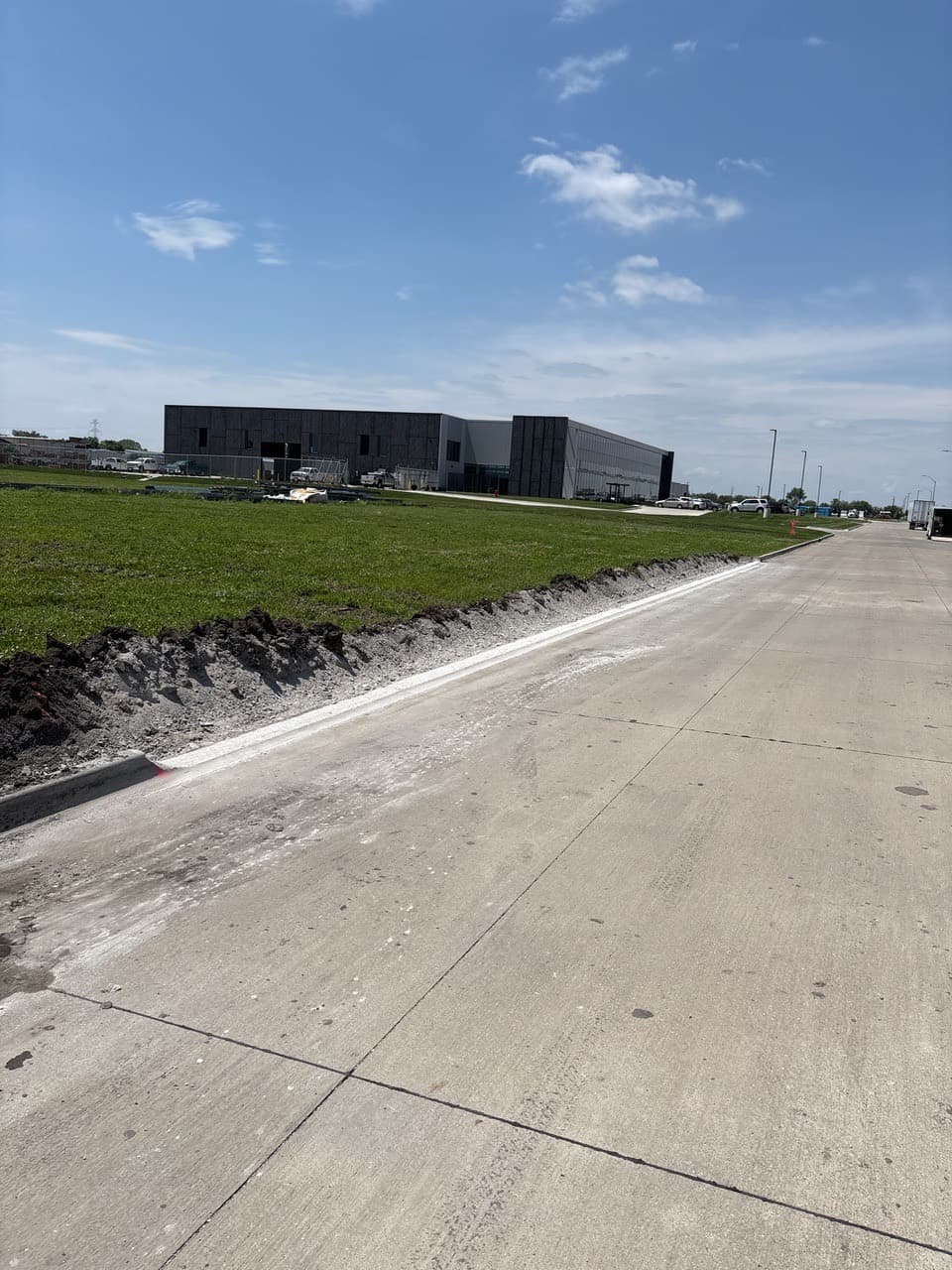 Curb grinding for a driveway approach on SE 25th Street in Grimes, Iowa