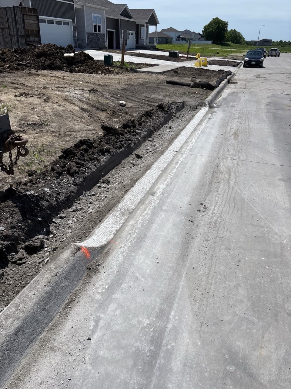 Freshly ground curb for a driveway approach on 173rd Street in Urbandale, Iowa