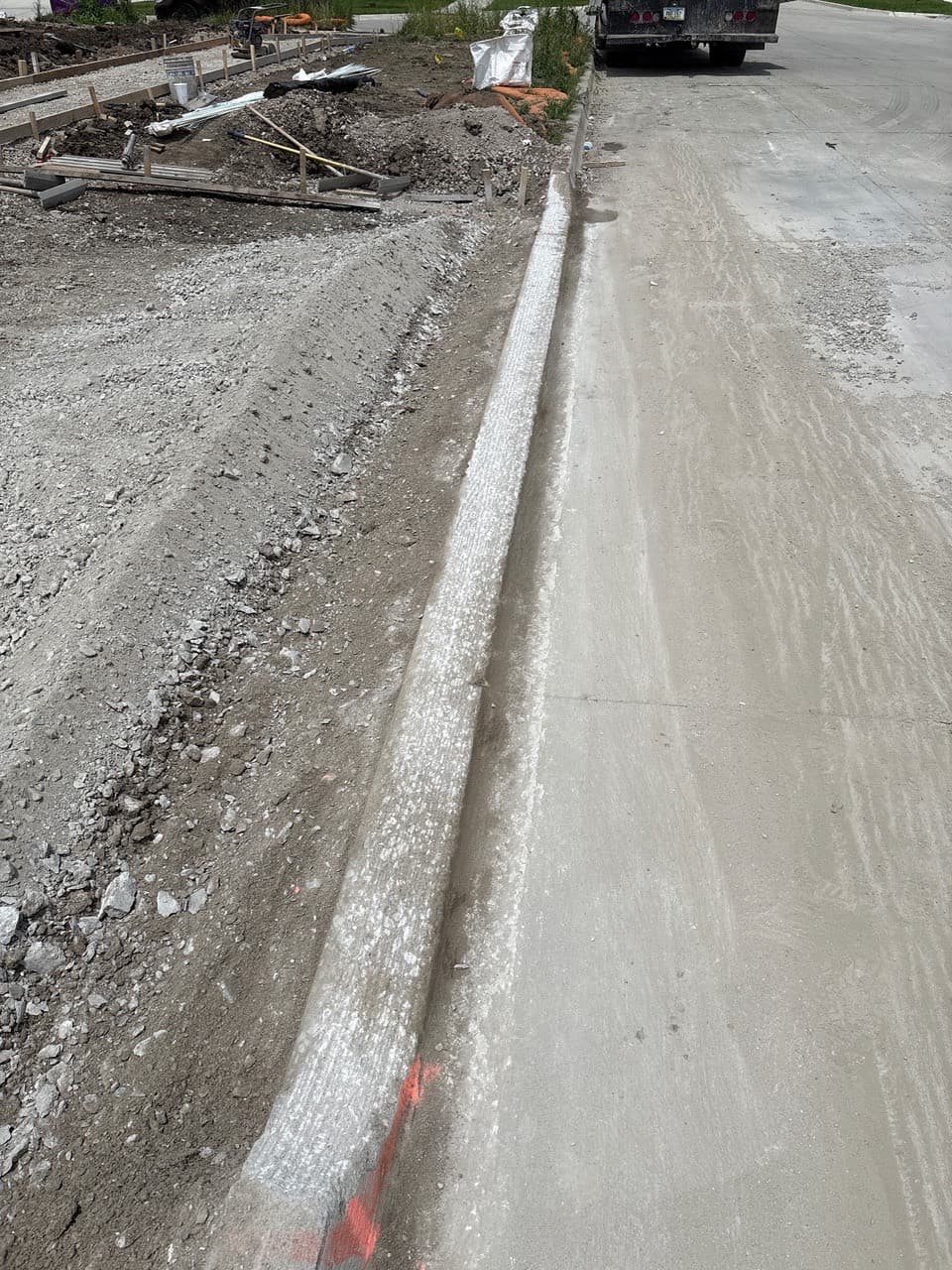 Curb grinding for a driveway approach on NW Alderleaf Drive in Waukee, Iowa